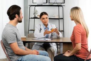 Couple consulting IVF doctor in Surat at Kusum Women’s Hospital